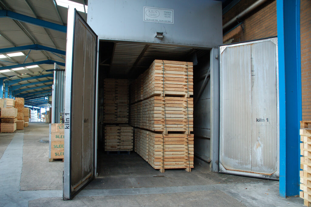 Pallets stacked inside the kiln for heat treatment