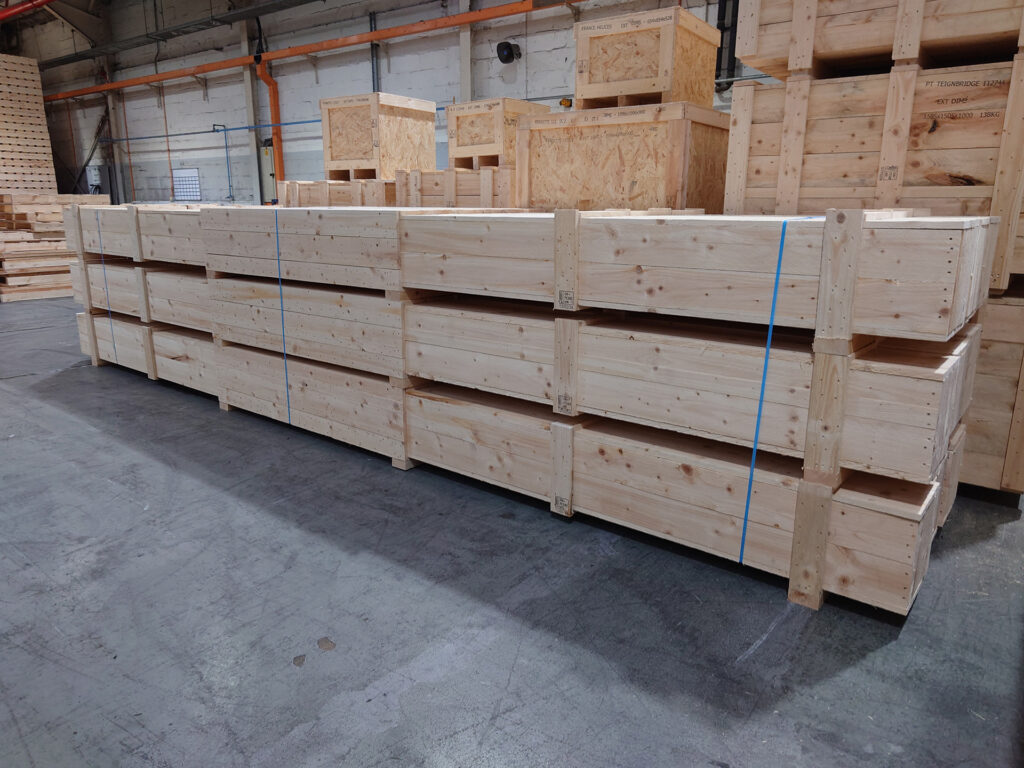 Long timber export crates strapped and stacked