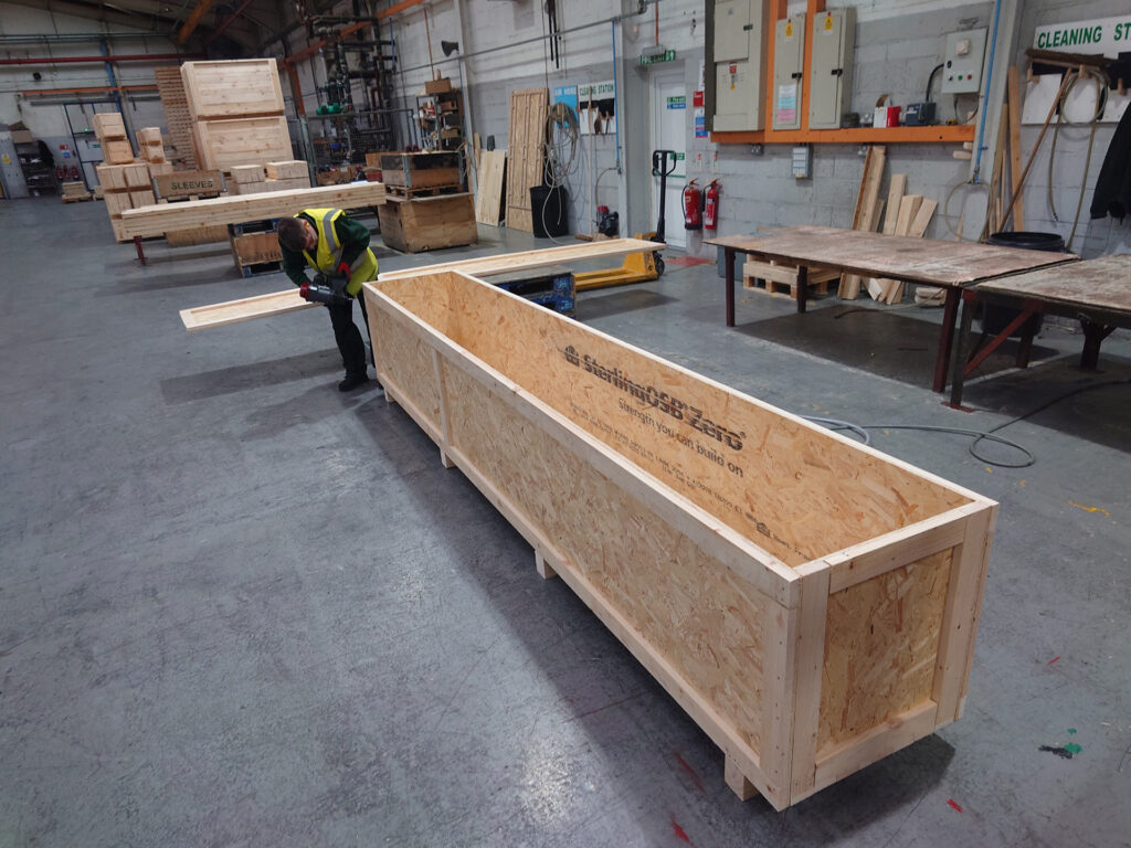 Open framed OSB crate on the assembly floor