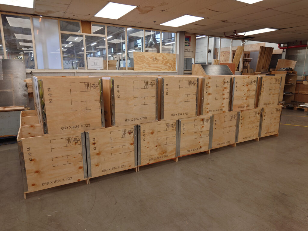 Row of plywood riveted cases with steel edging