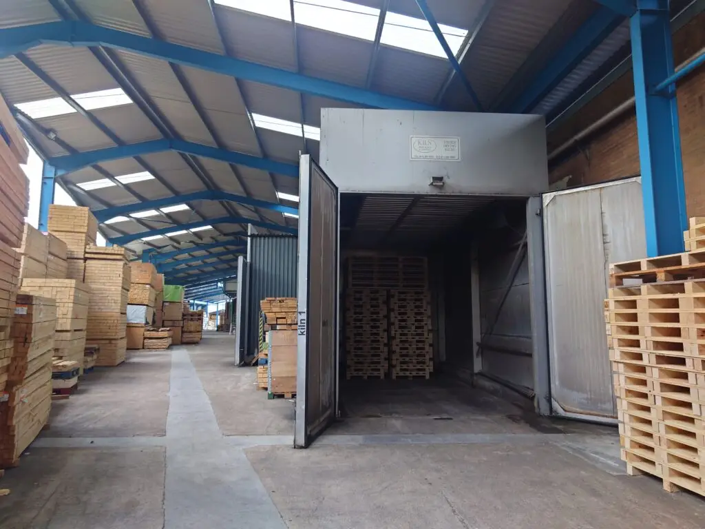 Kiln 1 at APS Packaging, Bideford, door open with a load of heat treated pallets inside
